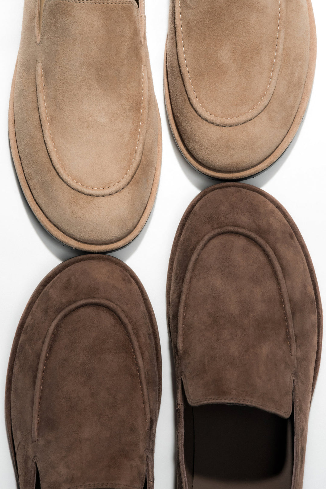 Women's beige flat loafers featuring a genuine suede upper.