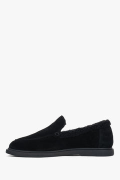 A pair of women's black loafers, crafted from velour and lined with soft fur.