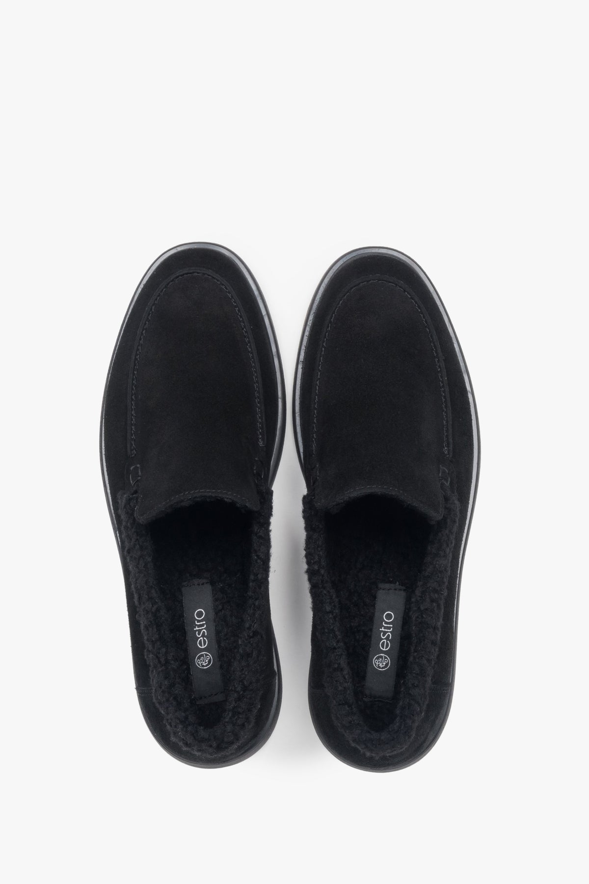 A pair of women's black velour loafers designed with a warm fur lining by Estro.
