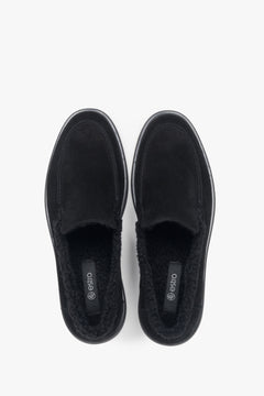 A pair of women's black velour loafers designed with a warm fur lining by Estro.