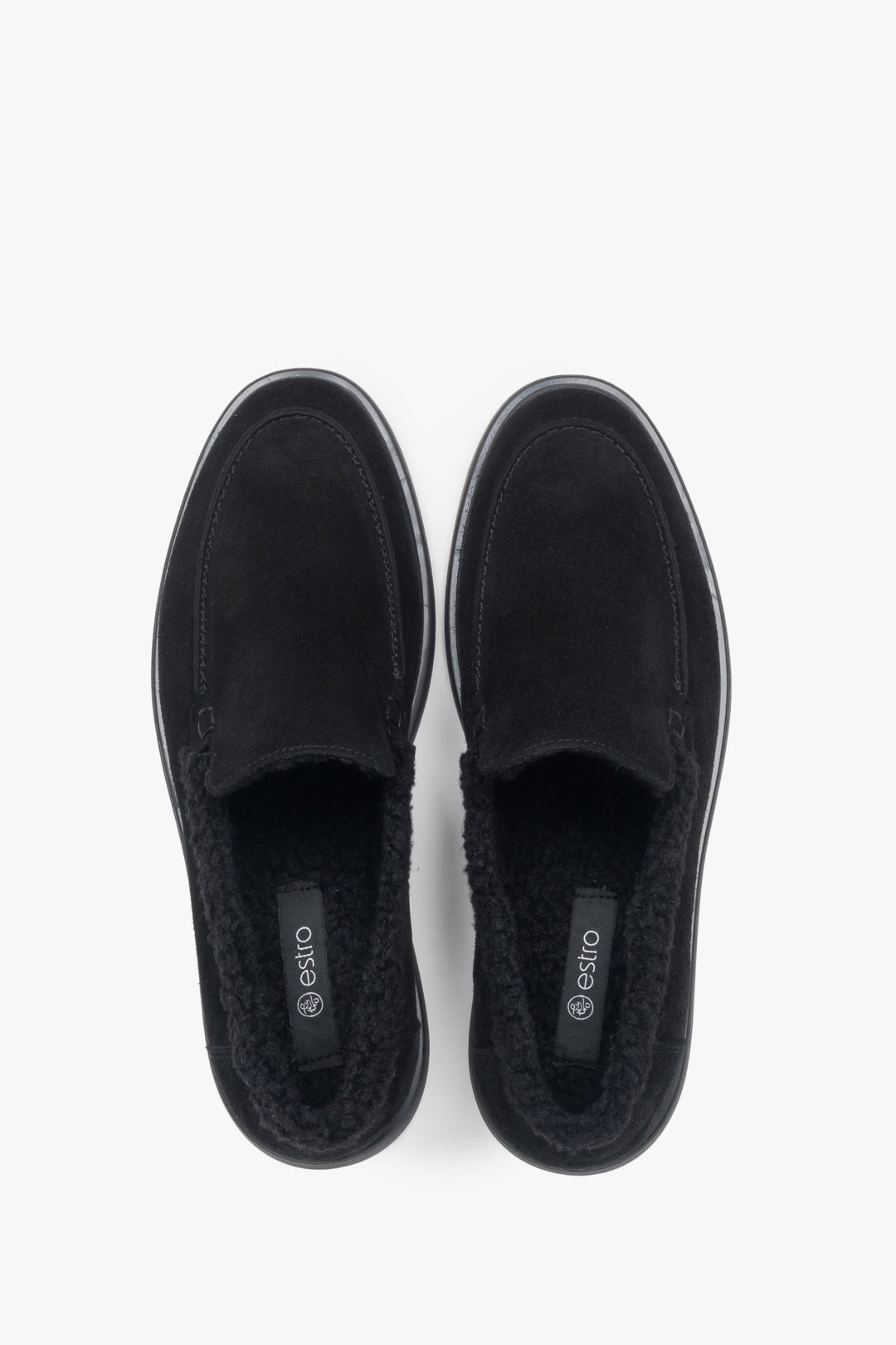 A pair of women's black velour loafers designed with a warm fur lining by Estro.