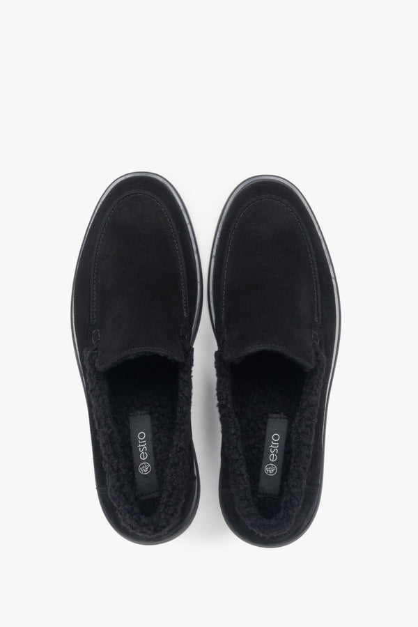 A pair of women's black velour loafers designed with a warm fur lining by Estro.