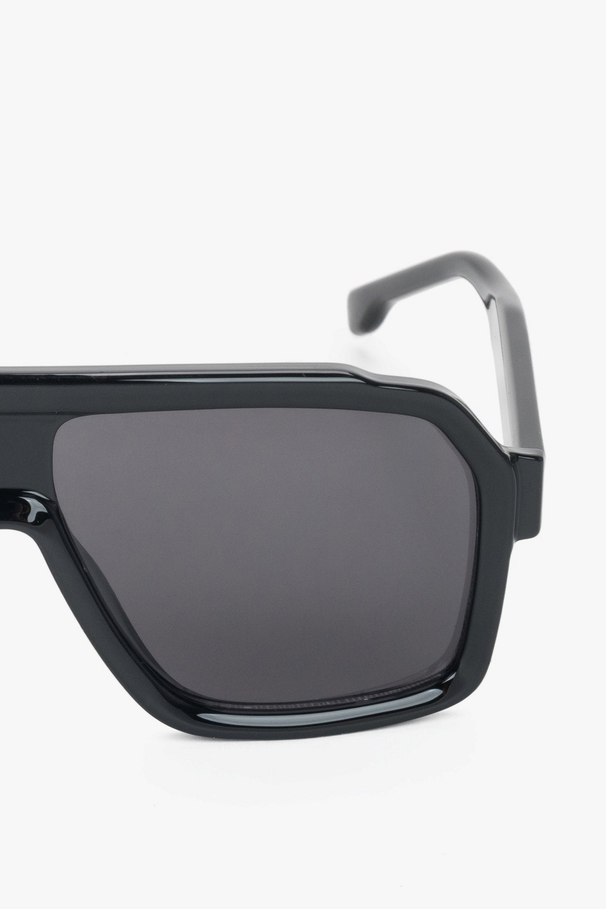 A pair of women's sunglasses with an angular black geometric frame, from the Estro collection.