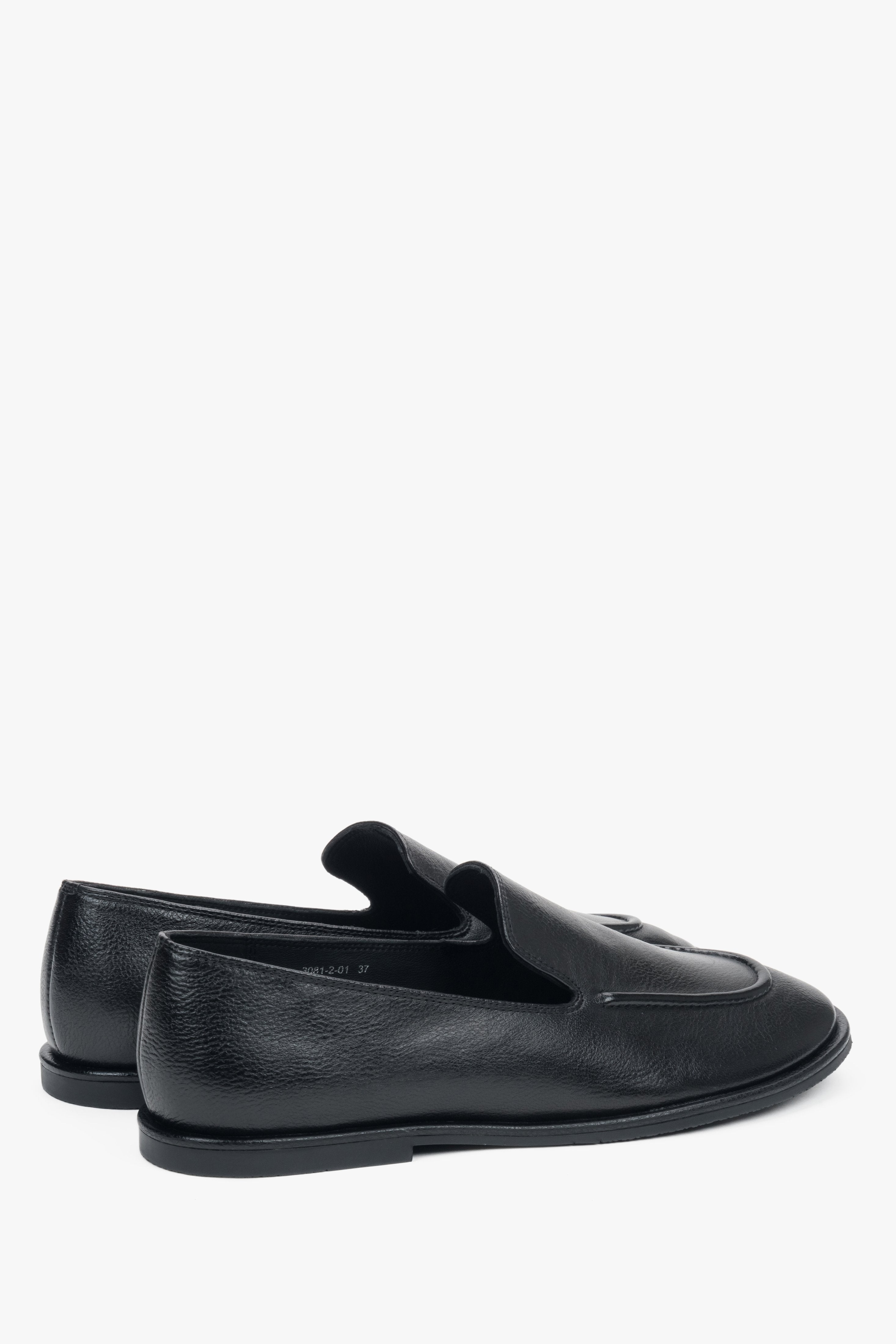 Side profile of the women's Estro flat loafer, showing the black genuine leather finish.