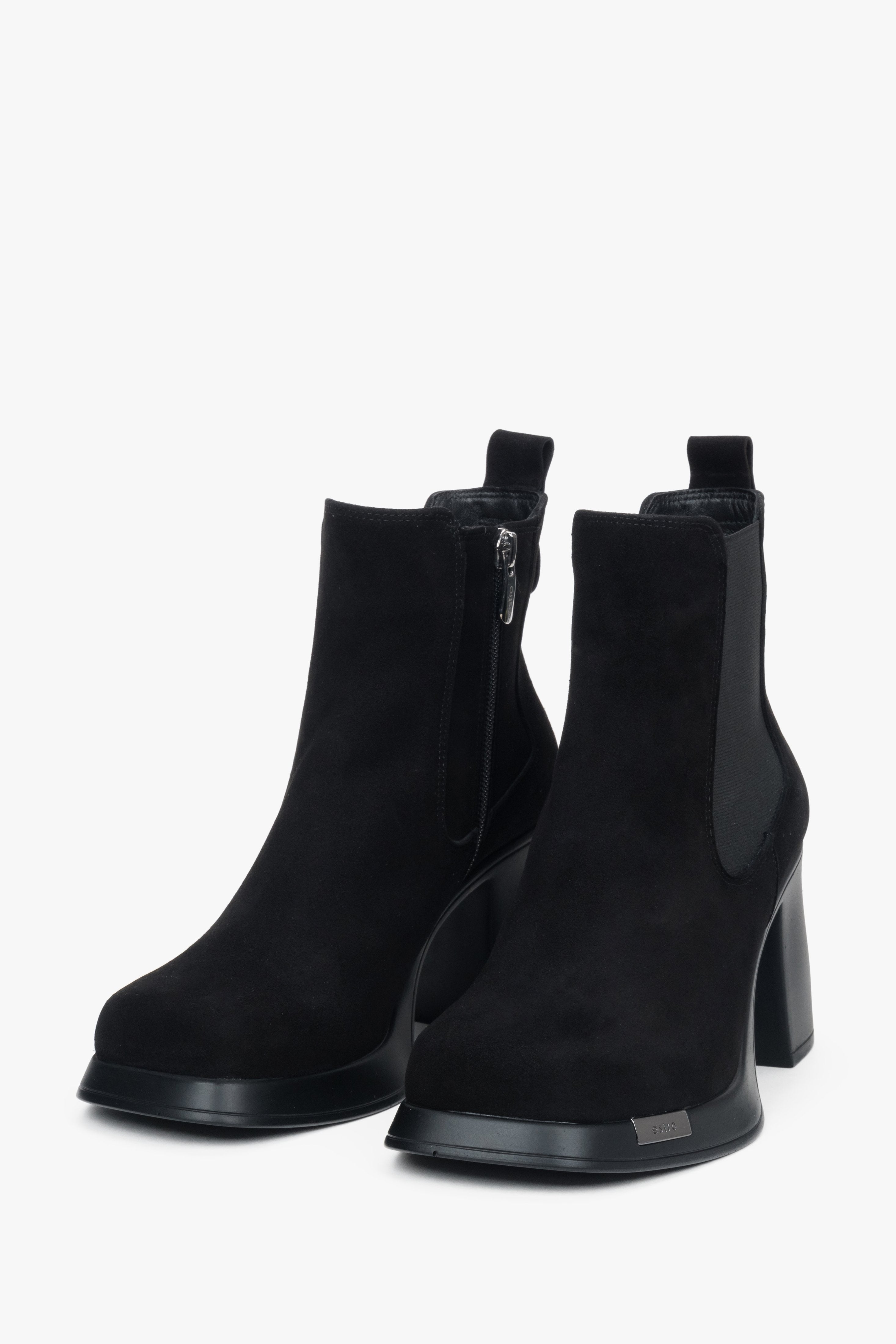 A pair of women's black suede ankle boots by Estro, featuring a stable block heel.