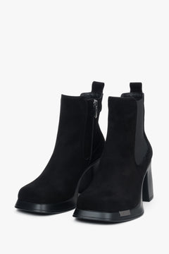 A pair of women's black suede ankle boots by Estro, featuring a stable block heel.