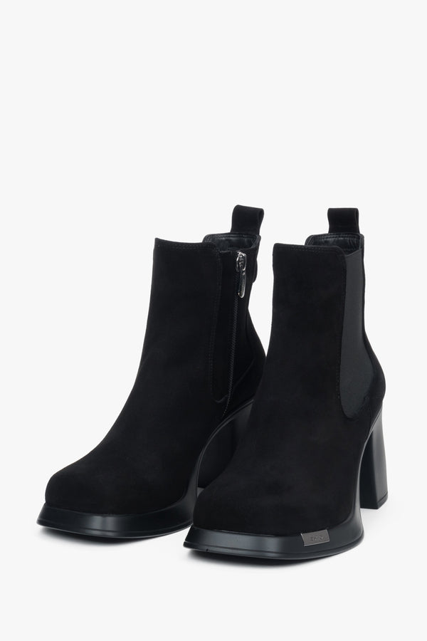 A pair of women's black suede ankle boots by Estro, featuring a stable block heel.