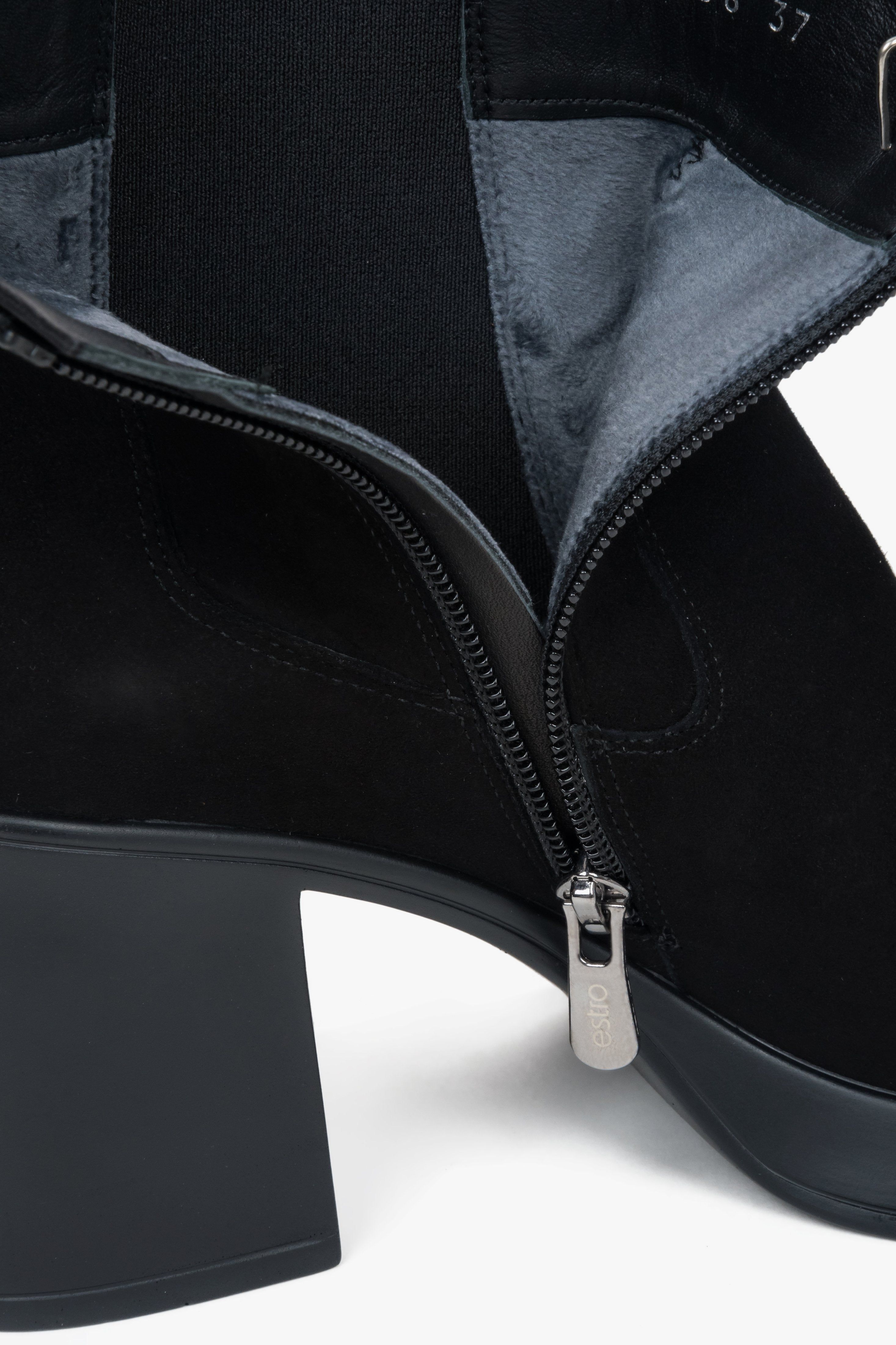 A pair of low-cut black ankle boots for women, constructed from genuine suede with a stable heel.