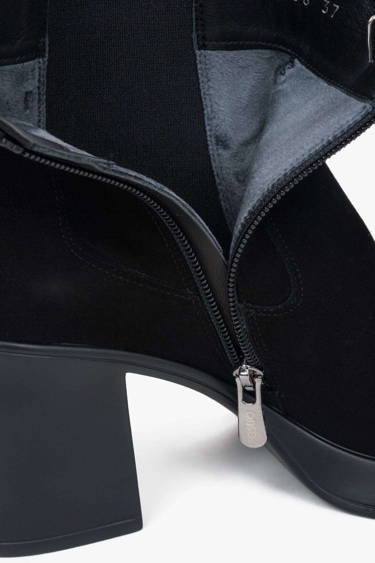 A pair of low-cut black ankle boots for women, constructed from genuine suede with a stable heel.