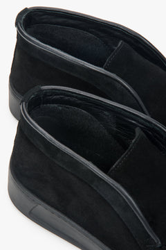 A pair of women's black loafers with a high-ankle silhouette, made from premium Italian velour by Estro.