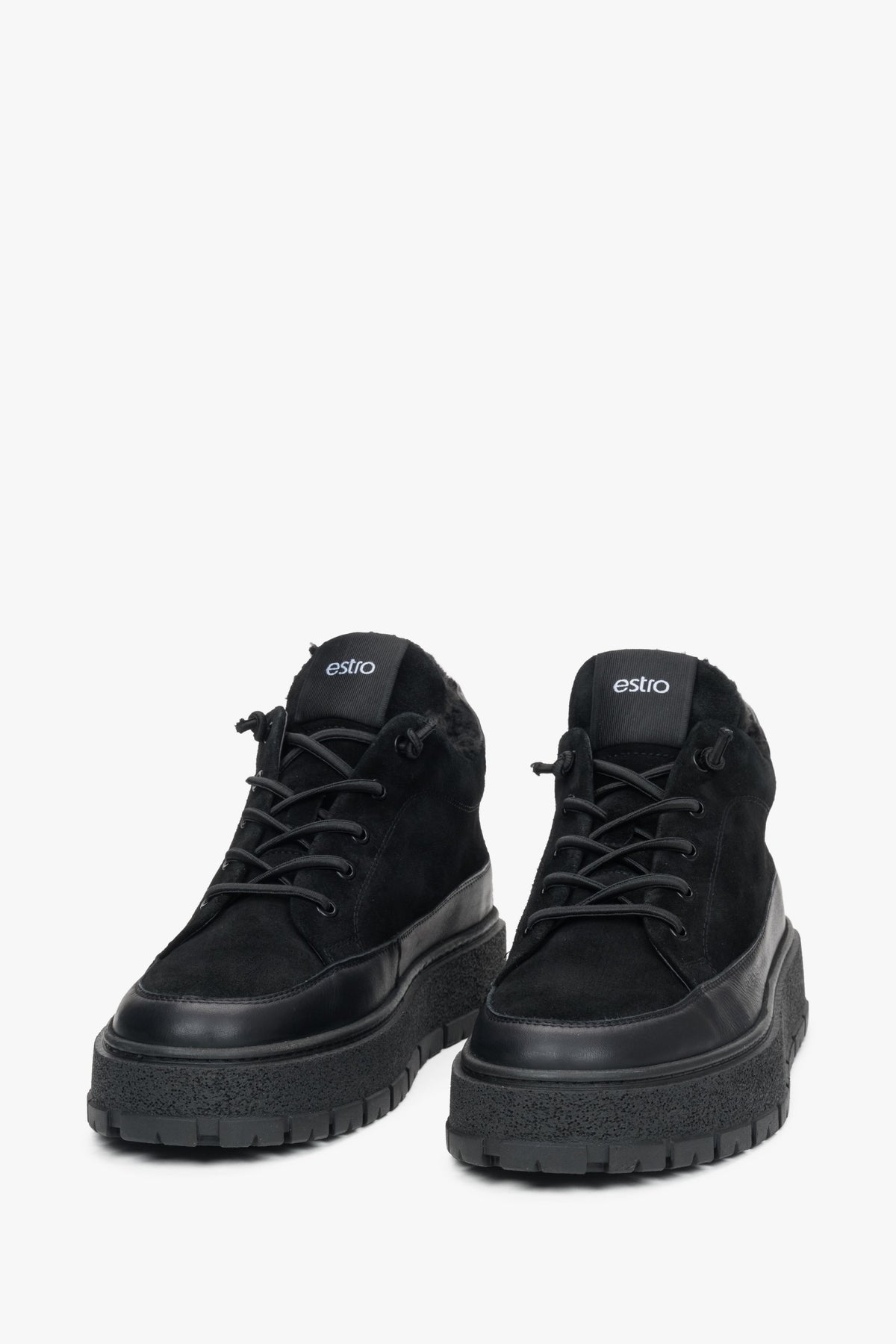 A pair of men's black high-top sneakers designed for warmth with a fur lining, made from Italian velour and leather by Estro.