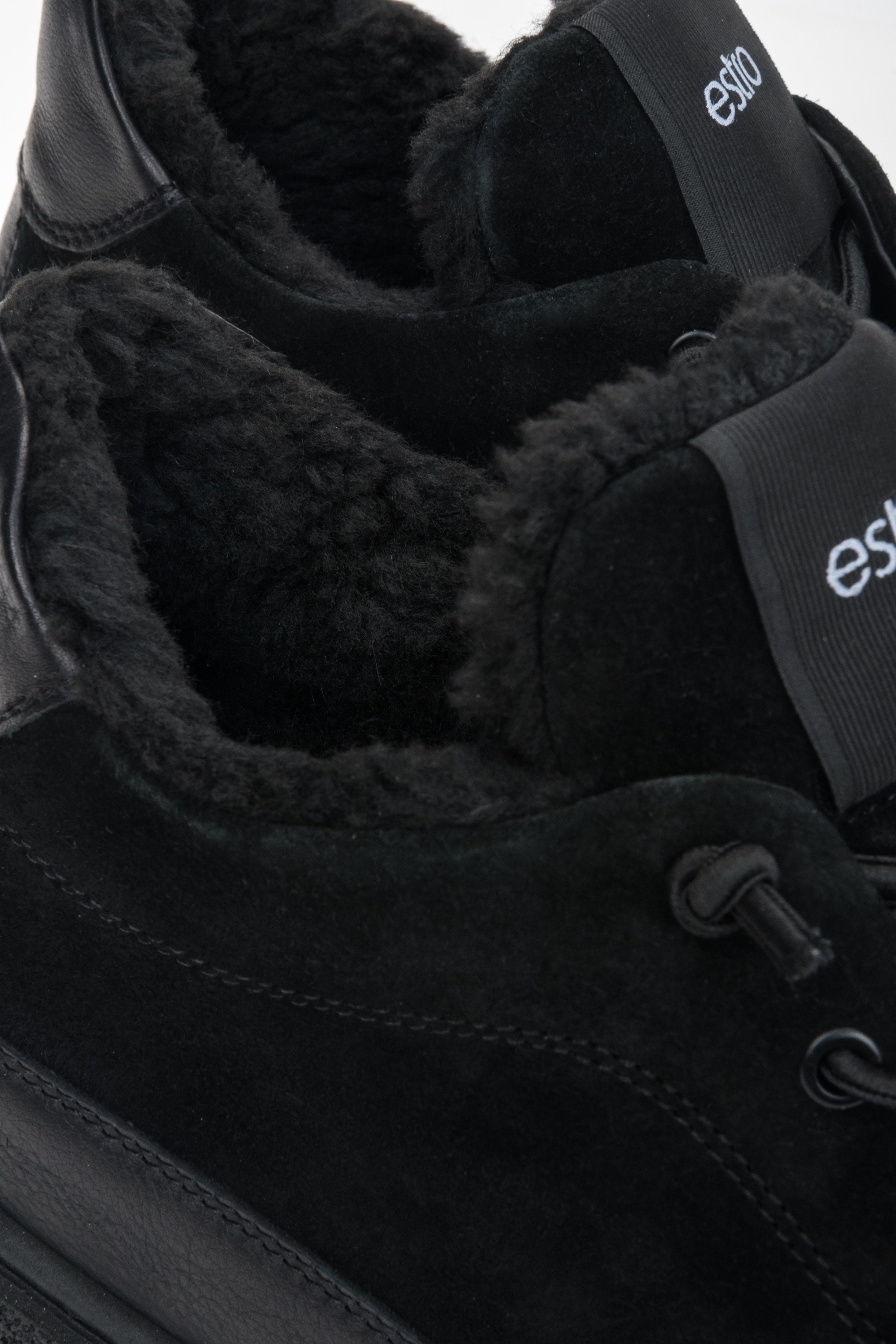 Men's black high-top sneakers featuring a fur lining and a premium Italian velour and leather upper.