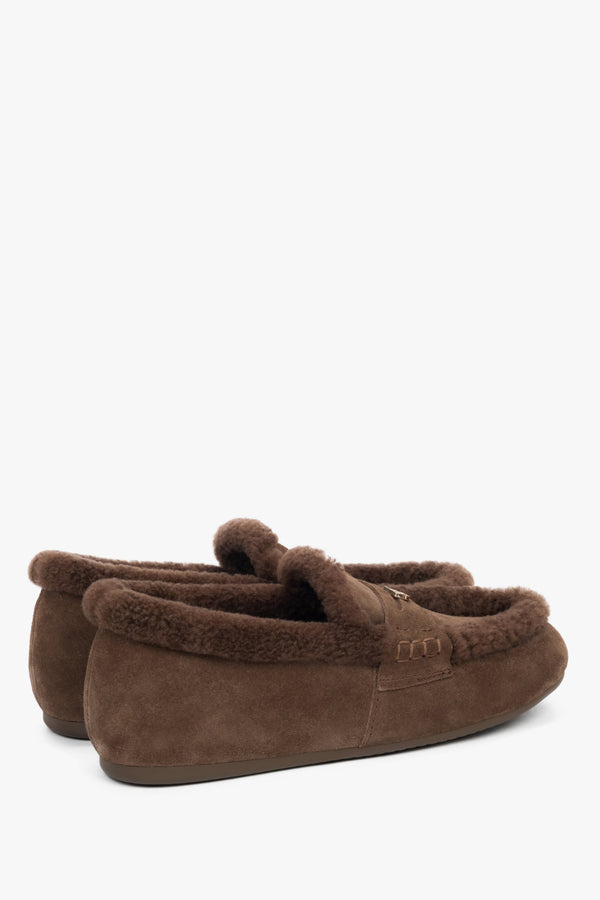 A pair of women's dark brown loafers designed for winter, with a genuine velour exterior and a cozy fur interior.