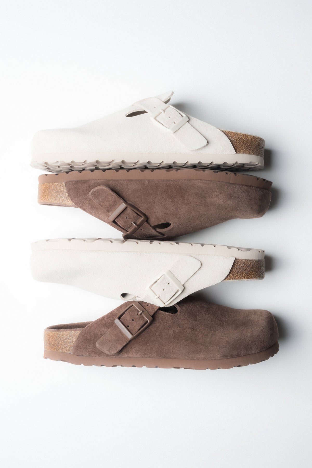 Side profile of the women's Estro dark brown clog, highlighting the soft suede texture.