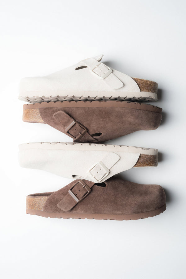 Side profile of the women's Estro dark brown clog, highlighting the soft suede texture.
