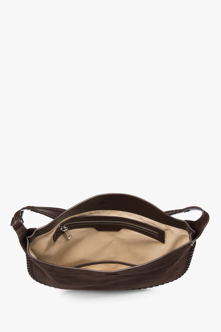 A women's shoulder bag in dark brown, showing its genuine velour texture.