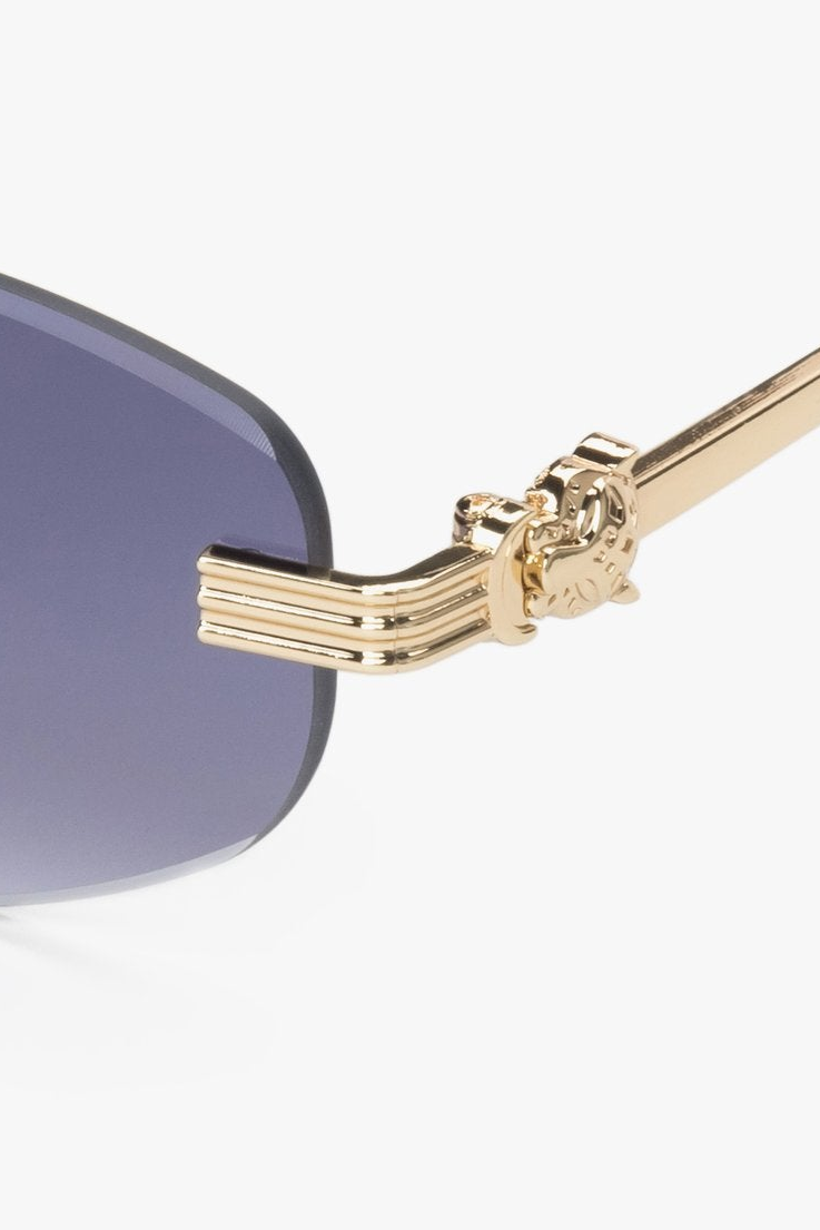 Women's oval rimless sunglasses in grey and gold by Estro.