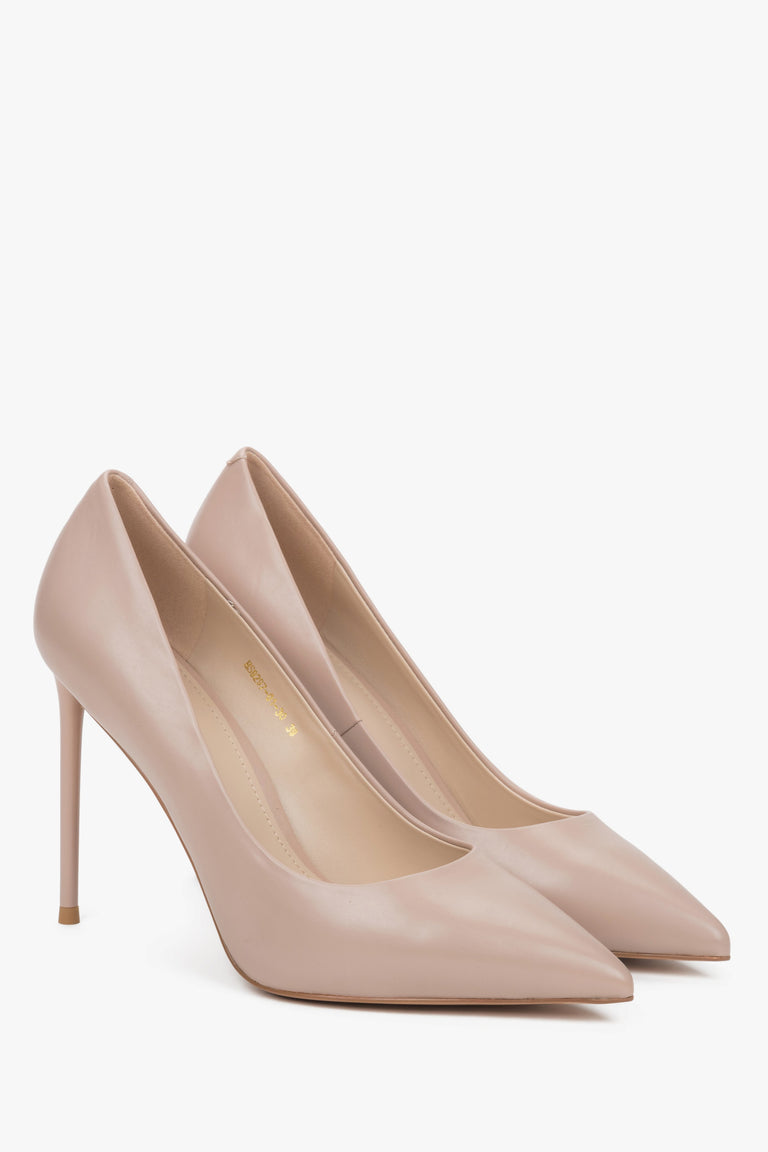 A pair of women's pumps in light beige, crafted from genuine leather with a high heel.