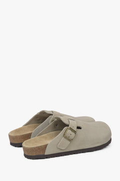 A pair of women's light grey slides by Estro, designed in a clog style with a soft genuine velour finish.