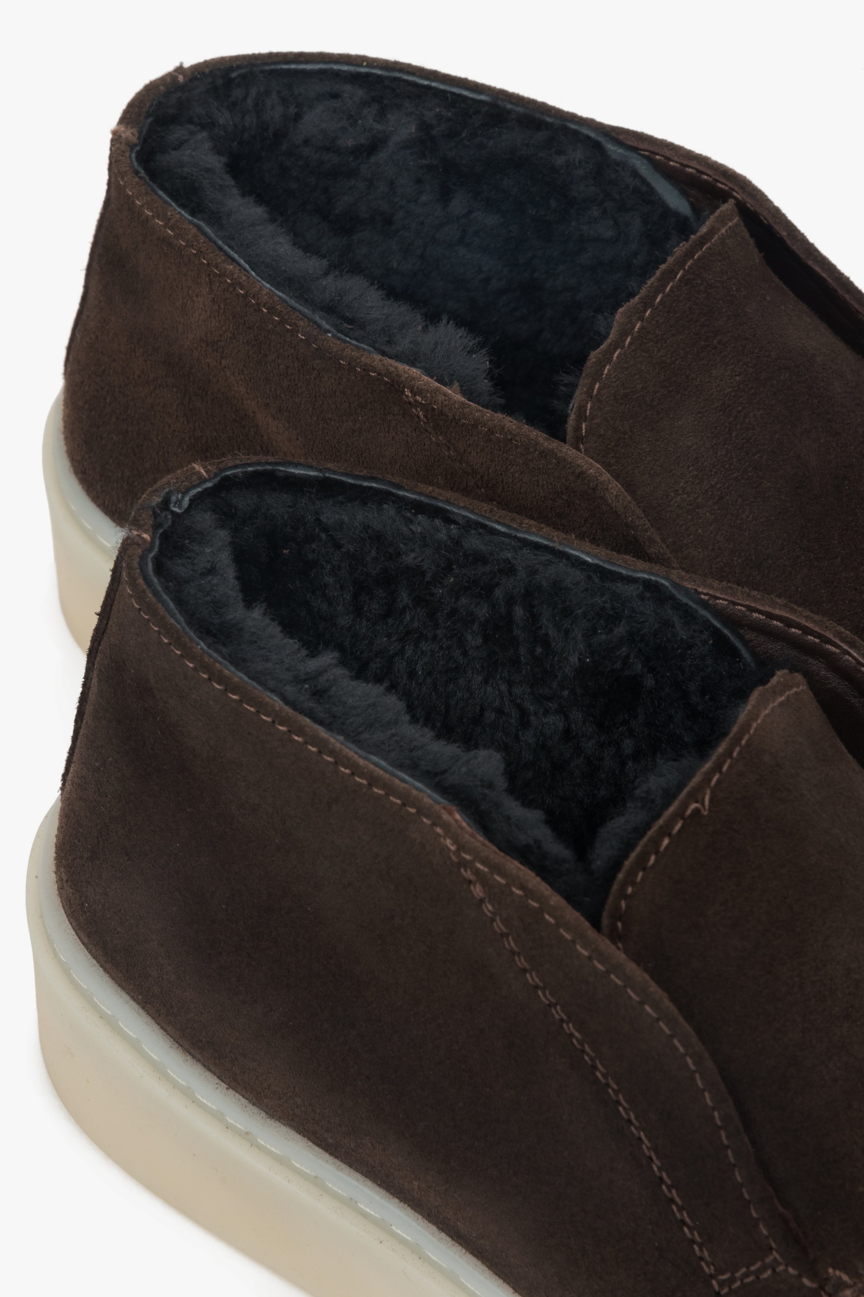 A pair of women's saddle brown loafers designed for winter, with a genuine Italian velour exterior and a cozy fur interior.