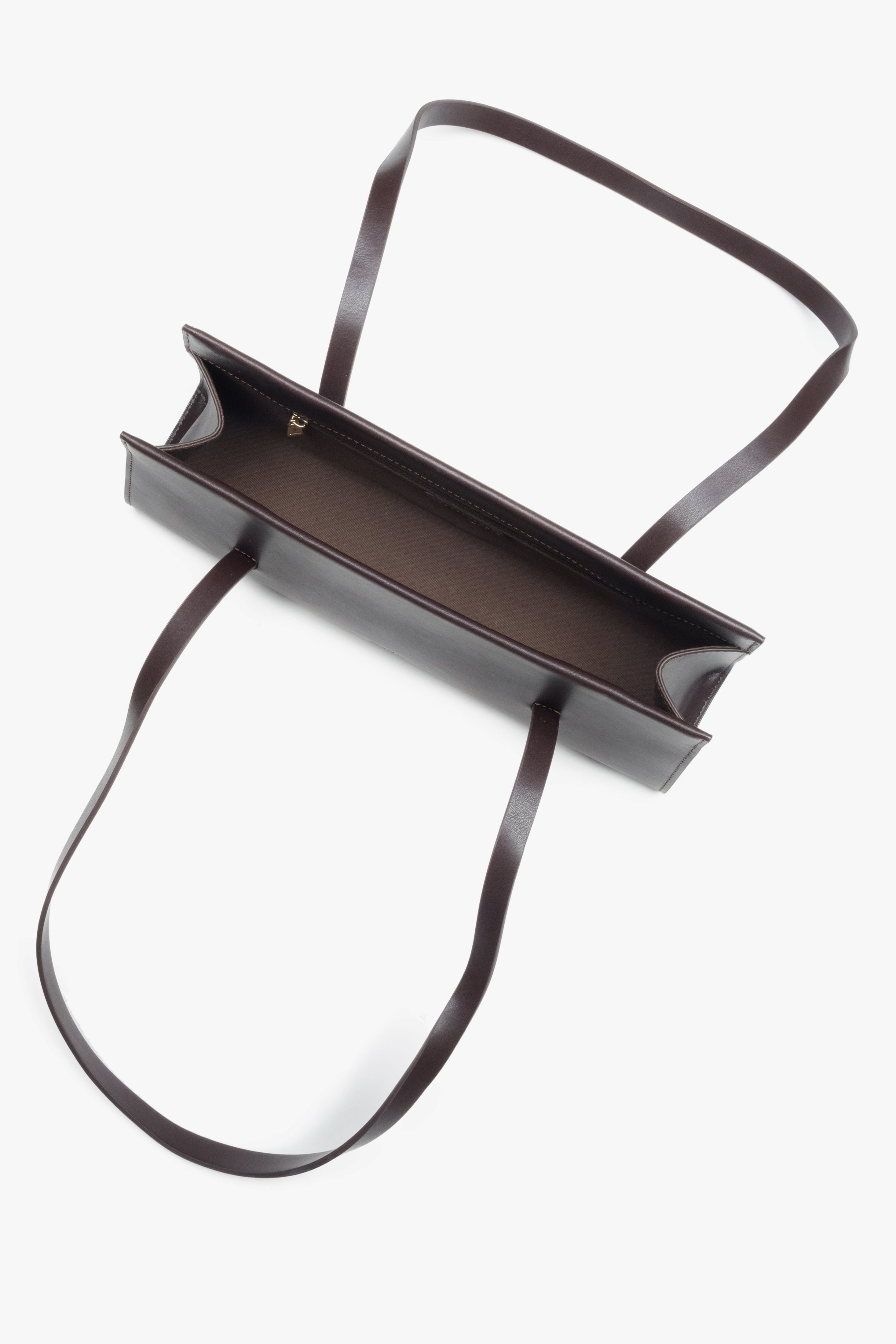 A women's shoulder bag by Estro, made from genuine saddle brown leather and designed with long handles for comfort.