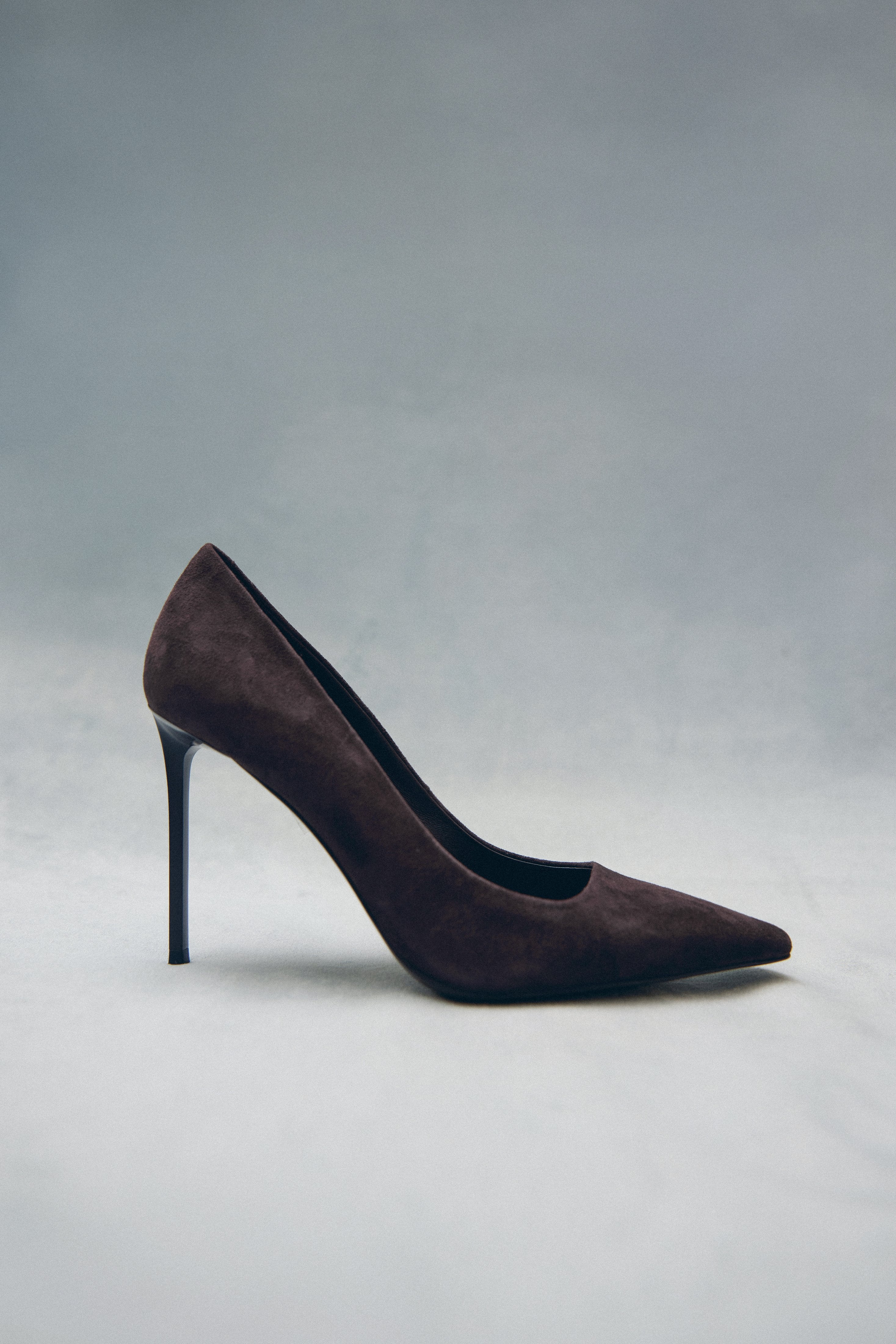 Side profile of the women's Estro heels, showing the saddle brown genuine velour finish.