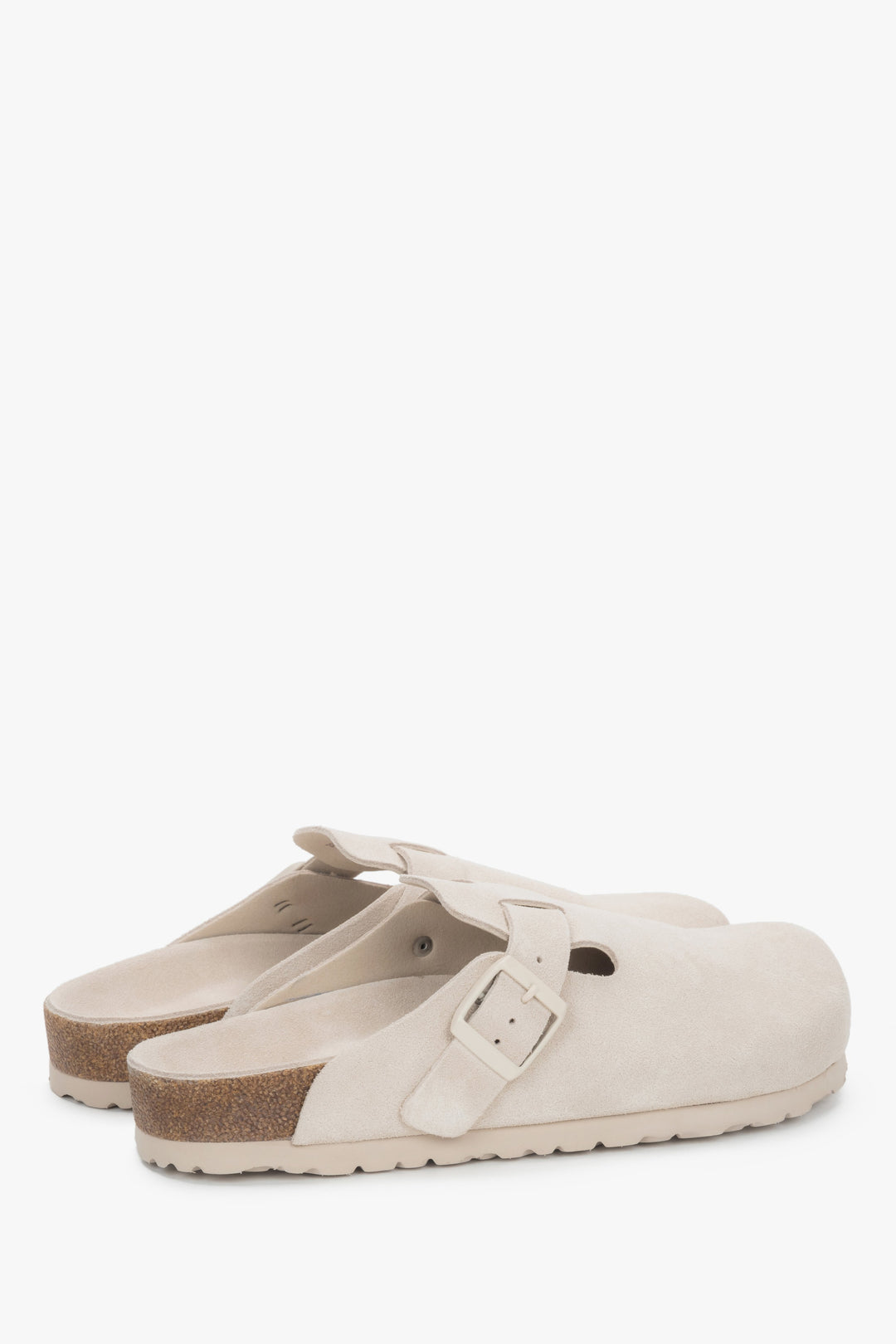 Side profile of the women's Estro clog-style slide, showing the white genuine velour.