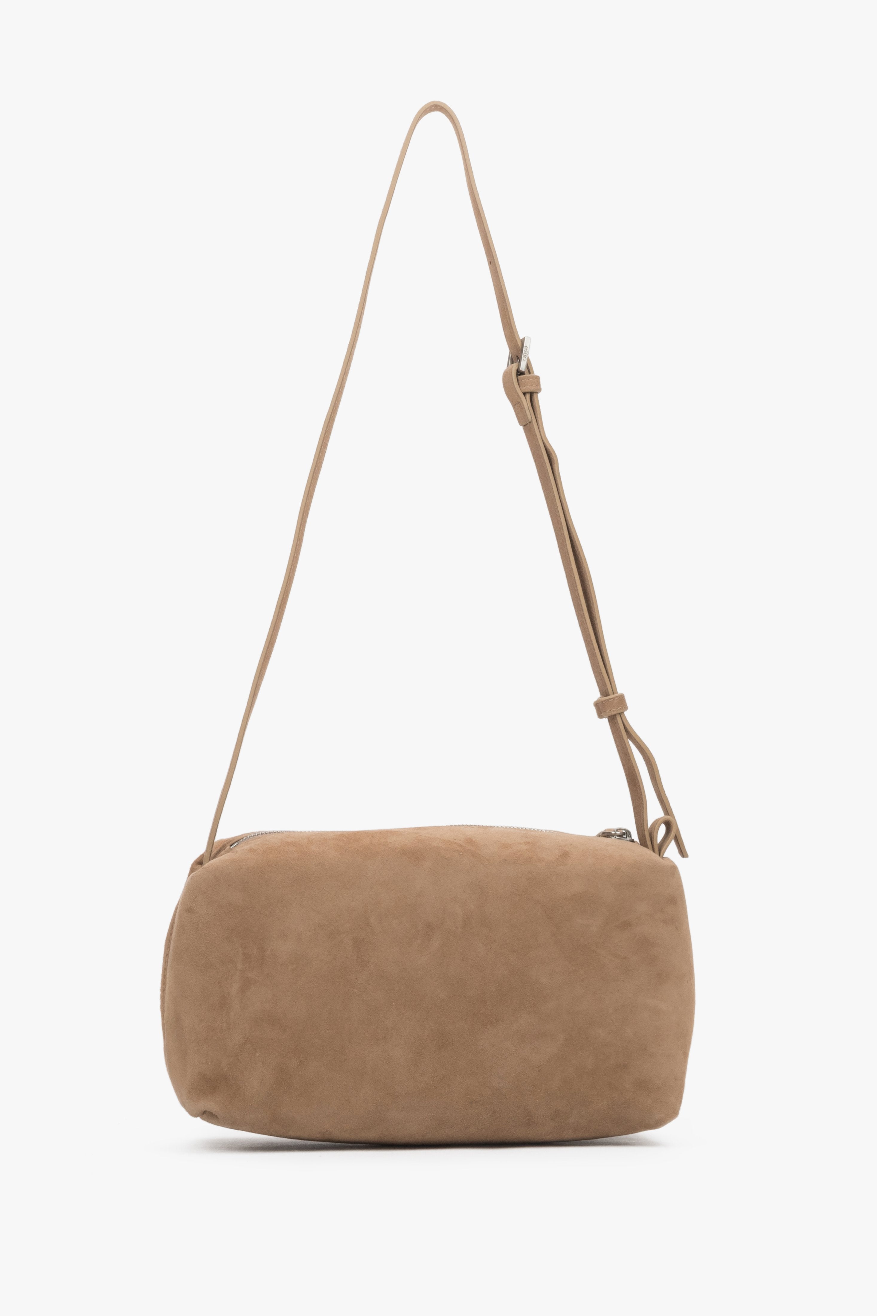 Back of women's beige genuine velour bag.