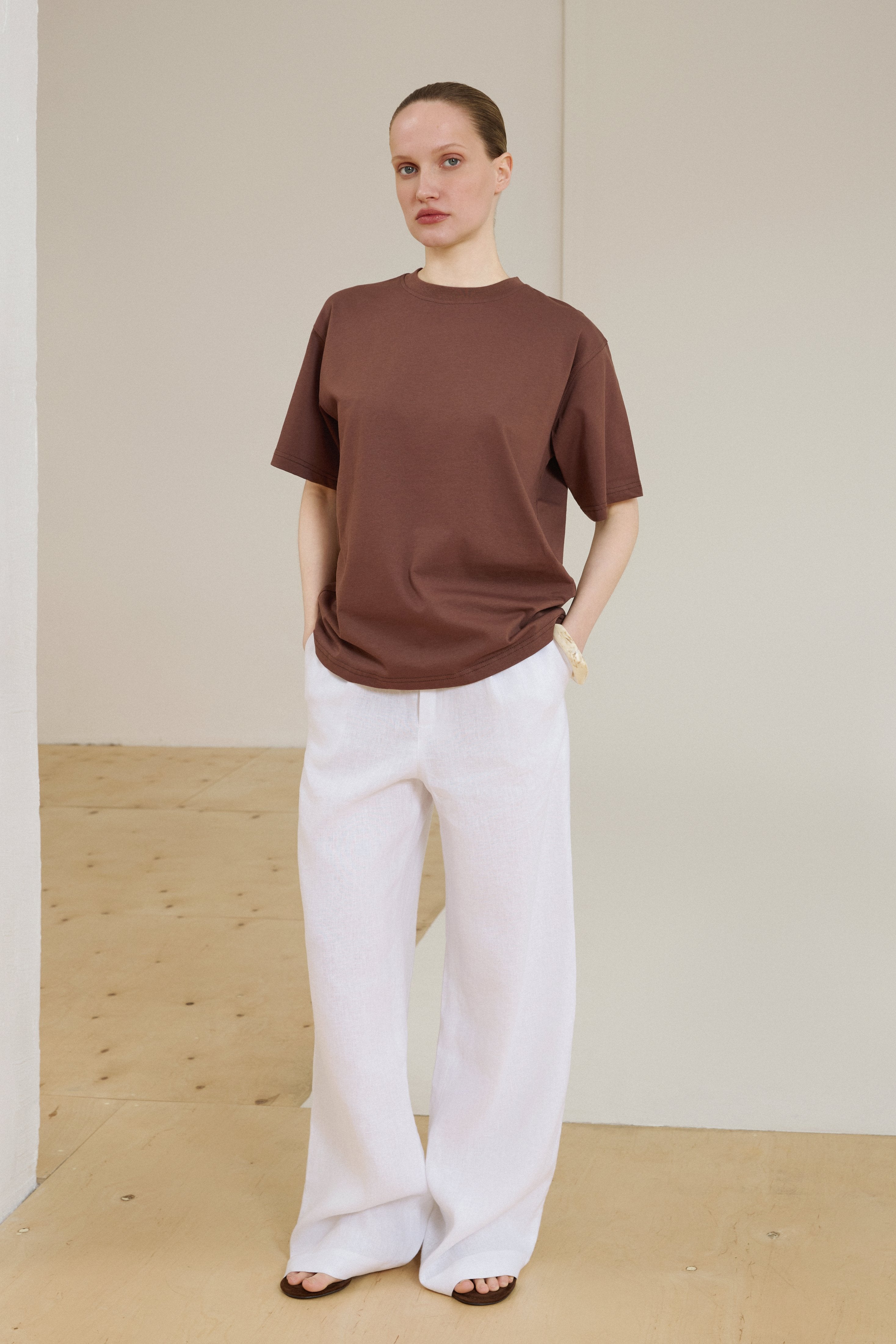 Women's dark brown T-shirt with boxy fit.