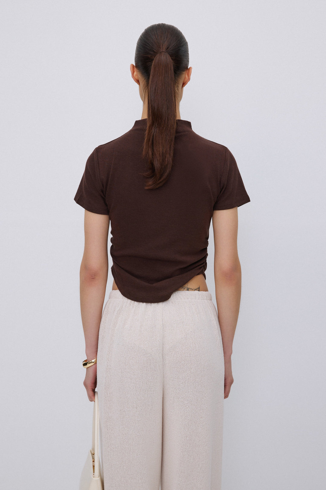 Back of women's dark brown soft cotton T-shirt.