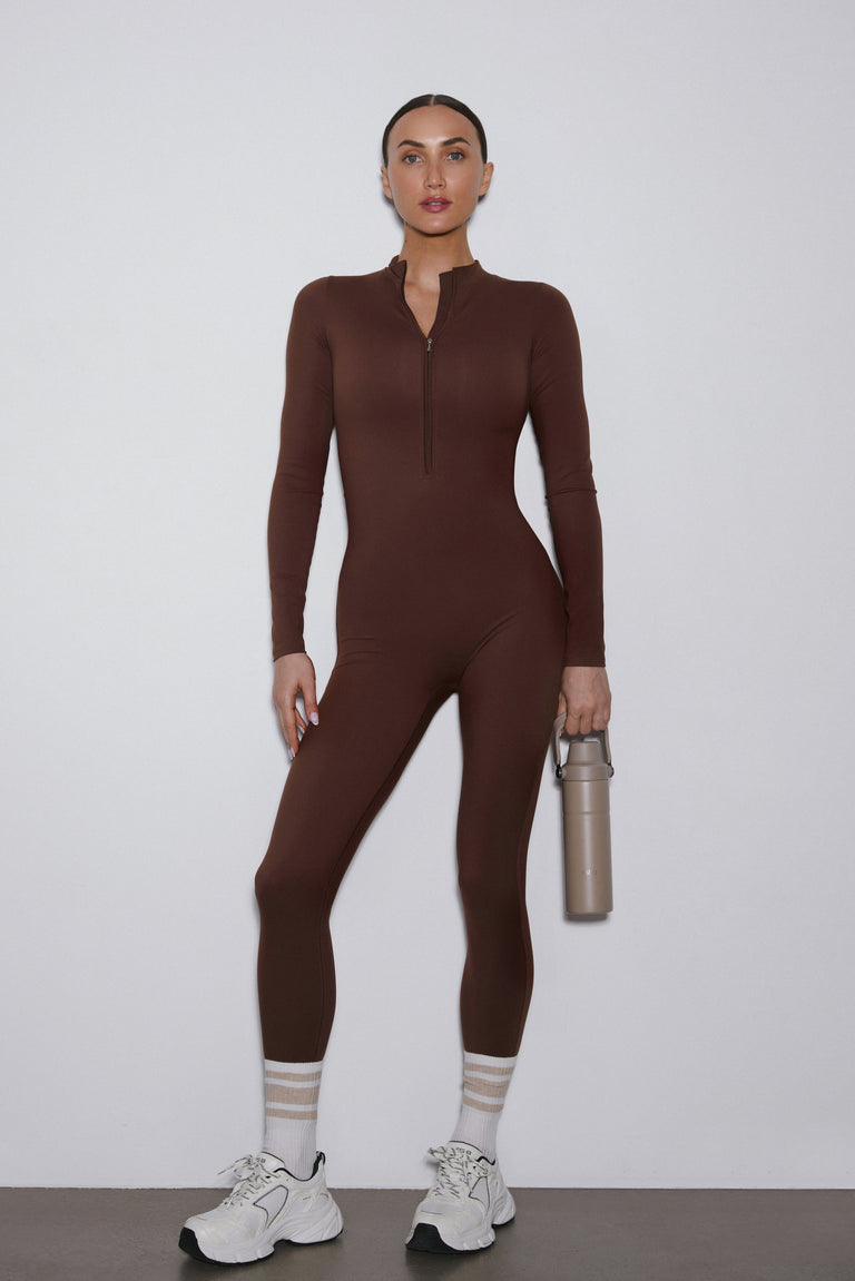 Dark brown long sleeve sporty jumpsuit by Estro.