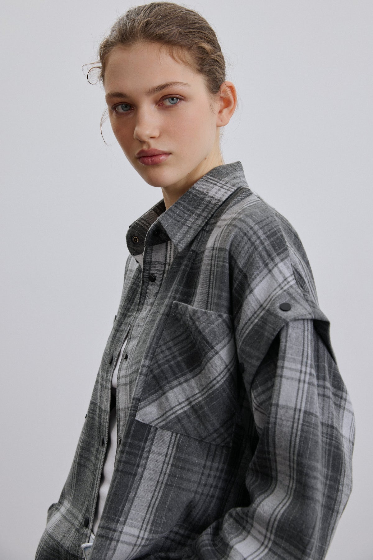 Close-up of Estro grey checkered fabric.