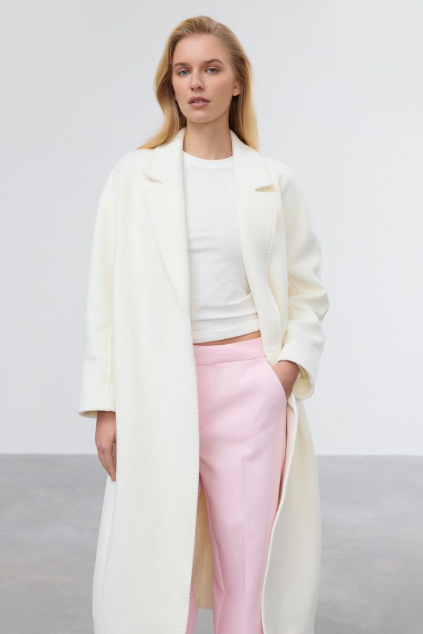 Milky beige belted bucket coat by Estro.