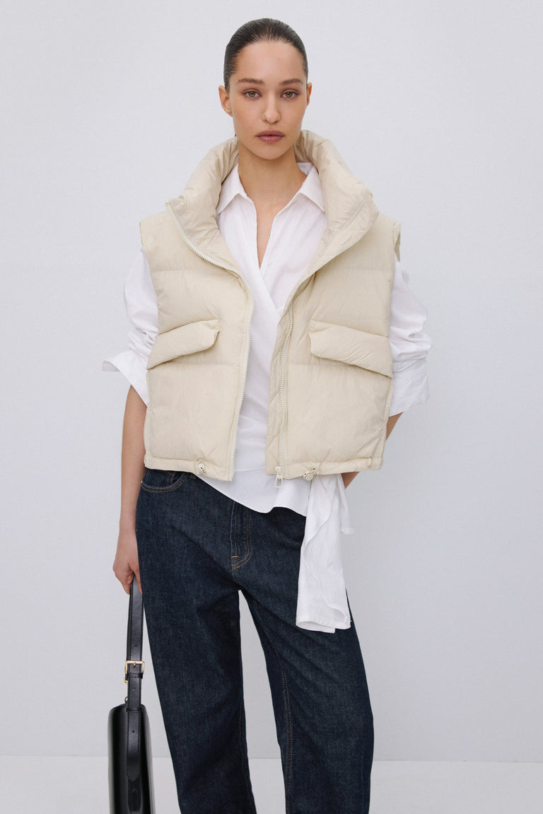 Short light beige puffer vest with zipper Estro.
