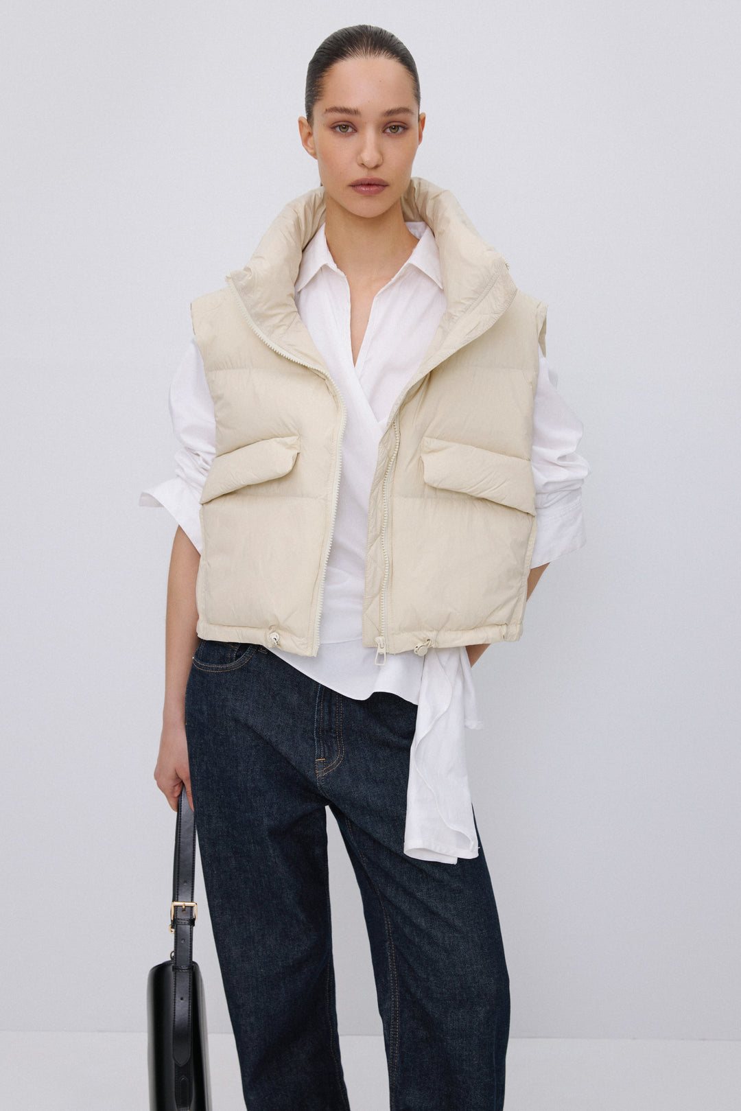 Short light beige puffer vest with zipper Estro.