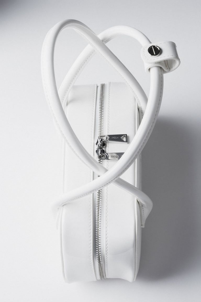 White patent leather shoulder bag.