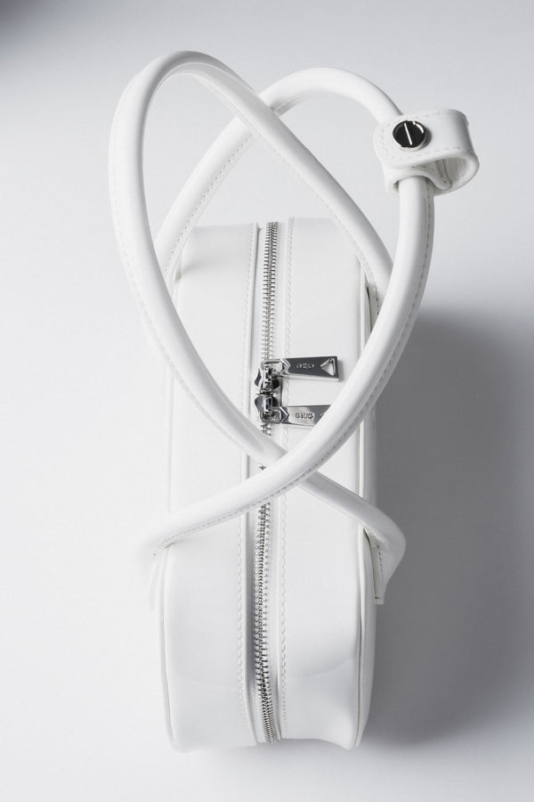 White patent leather shoulder bag.