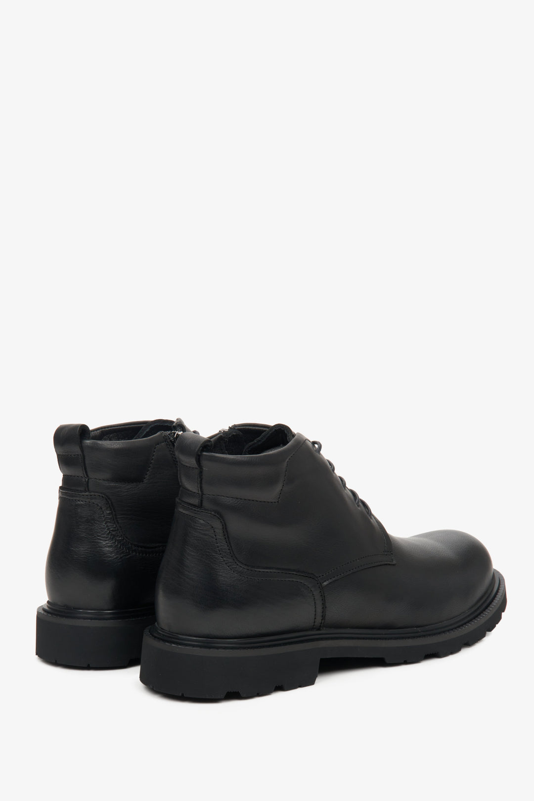 Black men's leather winter boots by Estro - close-up on the side welt and heel counter.