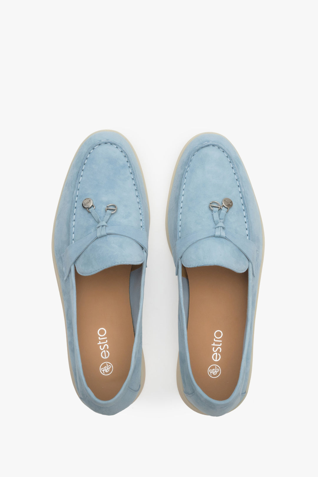 Light blue women's loafers of Estro brand made of velour and leather - presentation of the footwear from above.