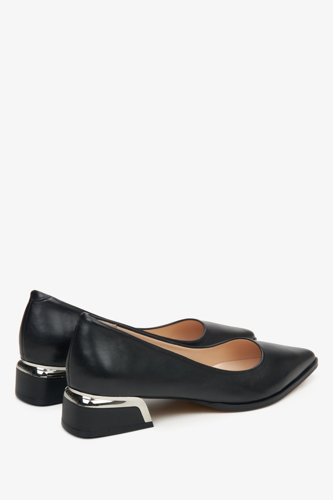 Women's black leather pumps by Estro - close-up on the side line and heel of the shoe.