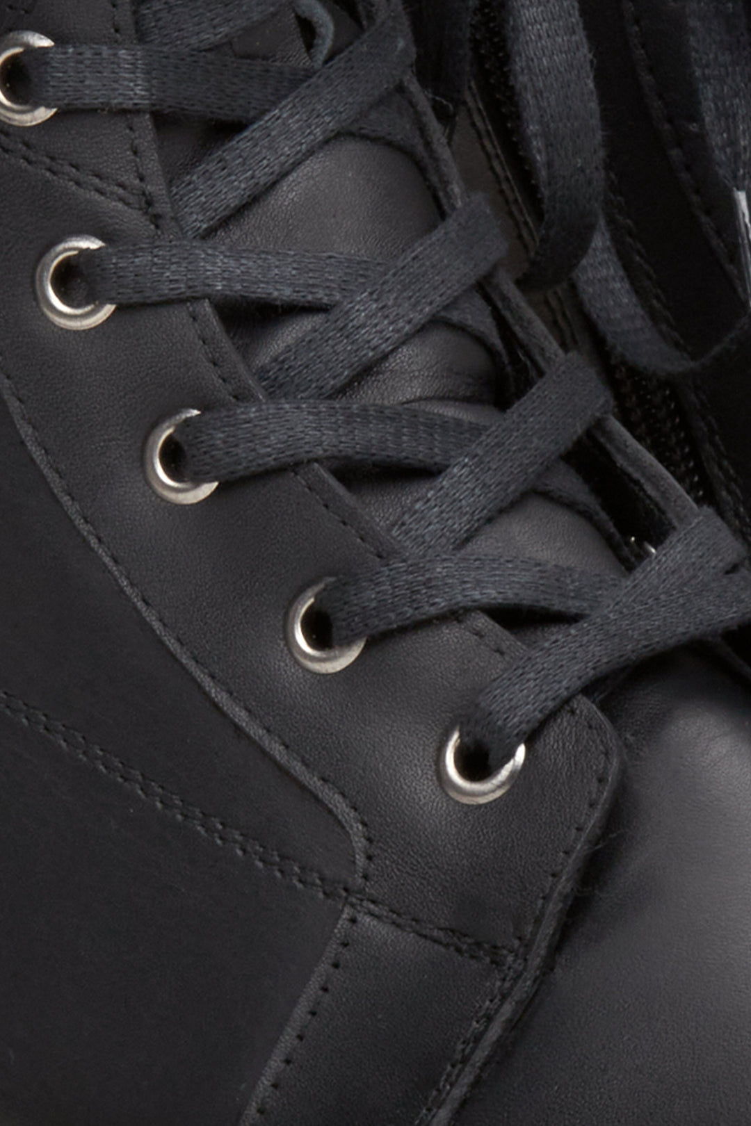 Women's black leather  boots by Estro - close-up on the decorative lacing.