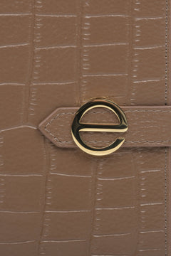 Women's large brown leather wallet by Estro - close-up on details.