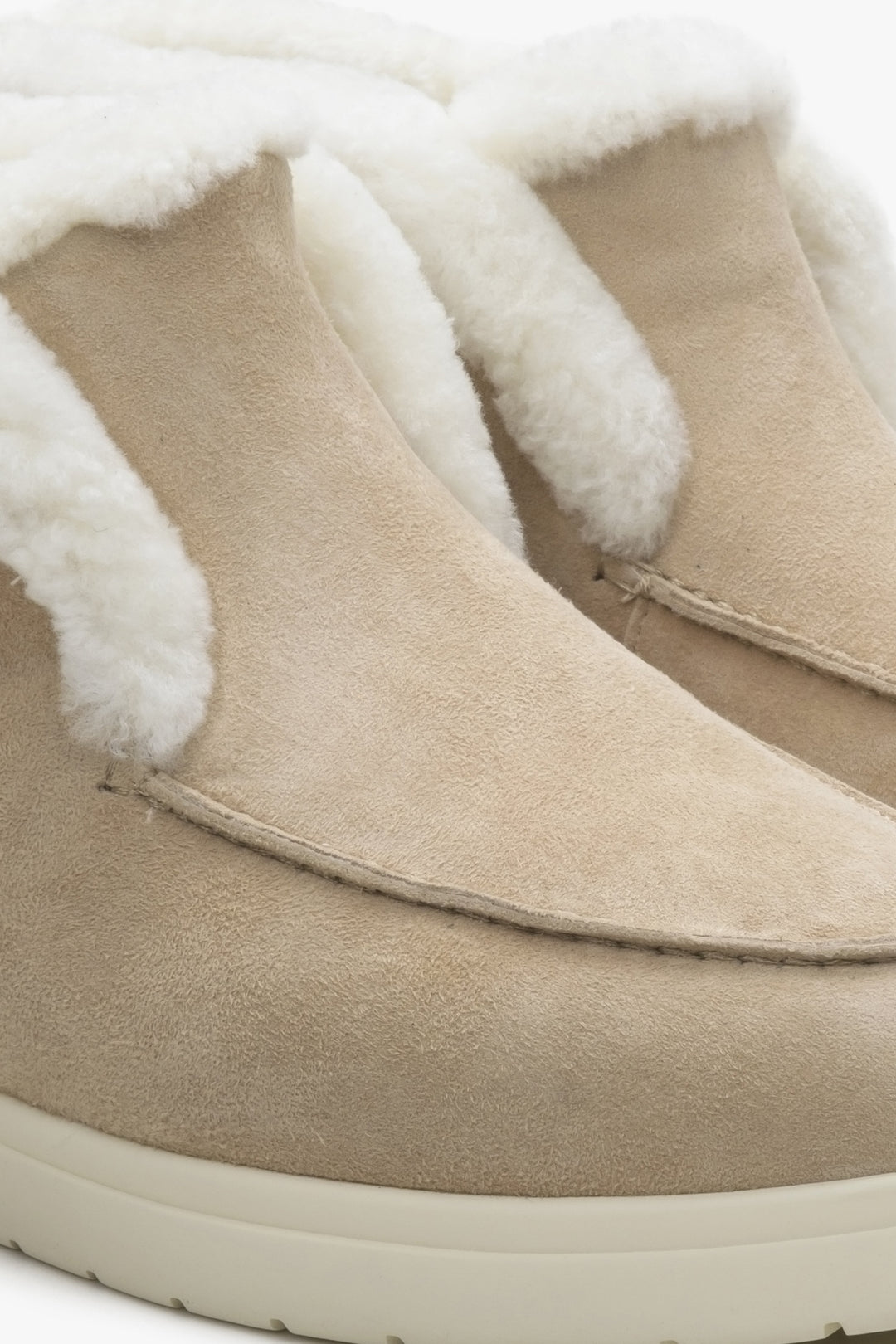 Women's fur and velour ankle boots in light beige colour.