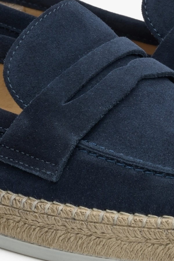 Navy blue men's velour moccasins - close-up on detail.