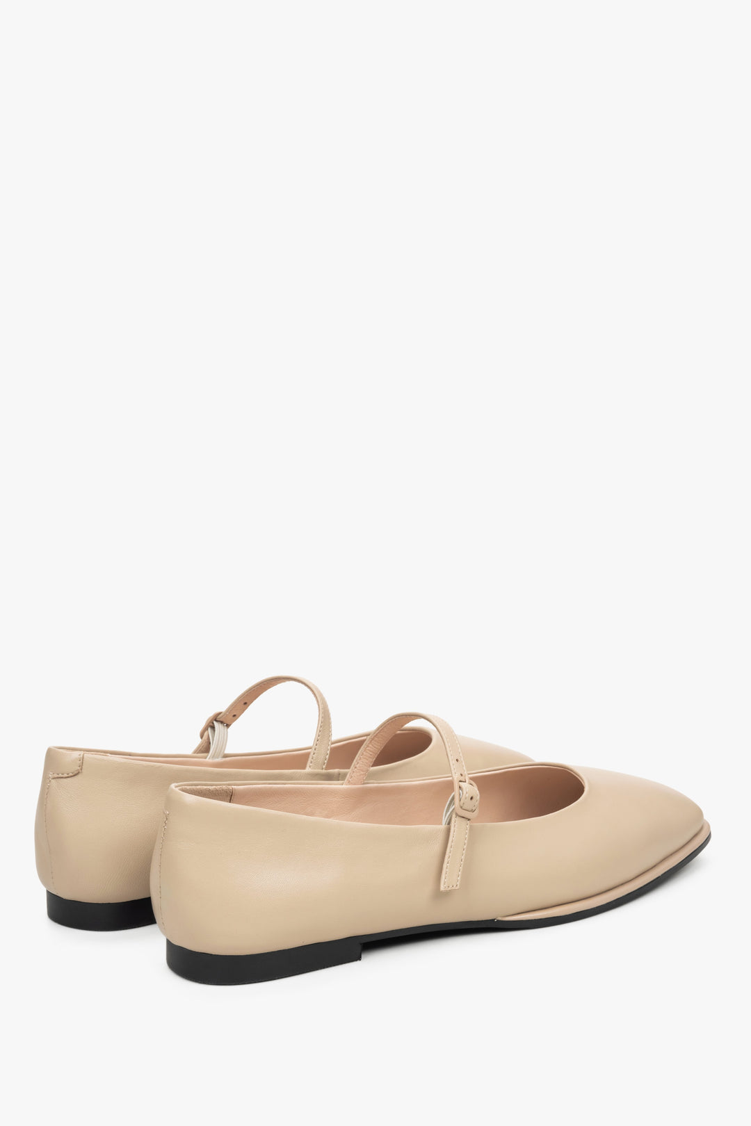Women's beige leather ballet flats by Estro - close-up on the heel and side line of the shoes.