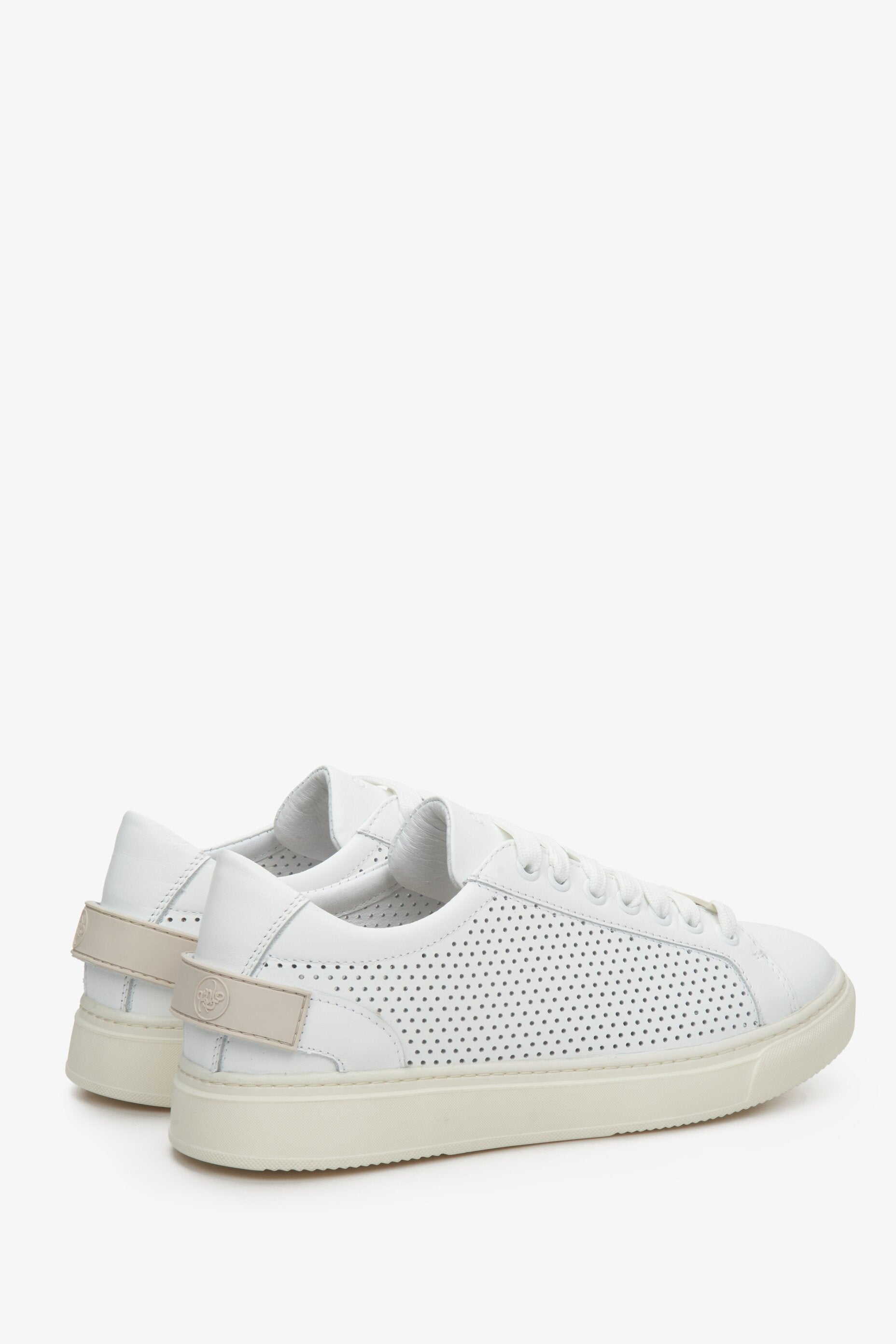 Women's white leather Estro sneakers with perforation for fall/spring - close-up on the heel and side seam.