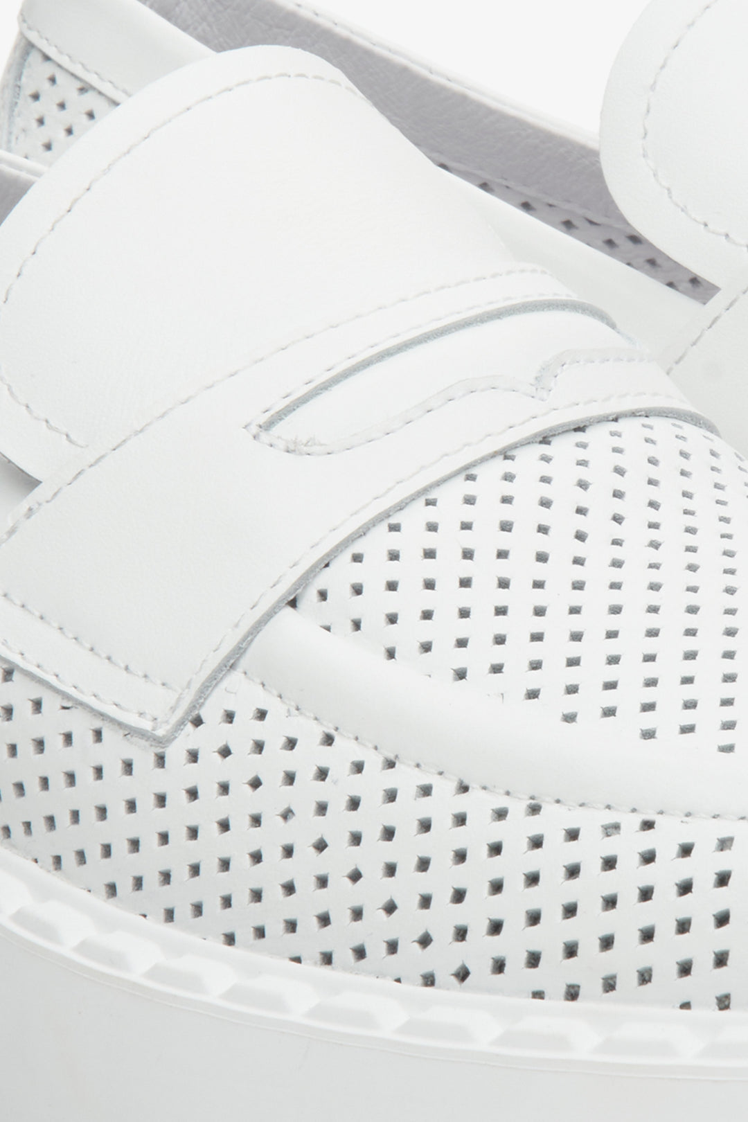 Women's leather loafers for summer in white color, brand Estro - close-up on the stitching system and perforation.