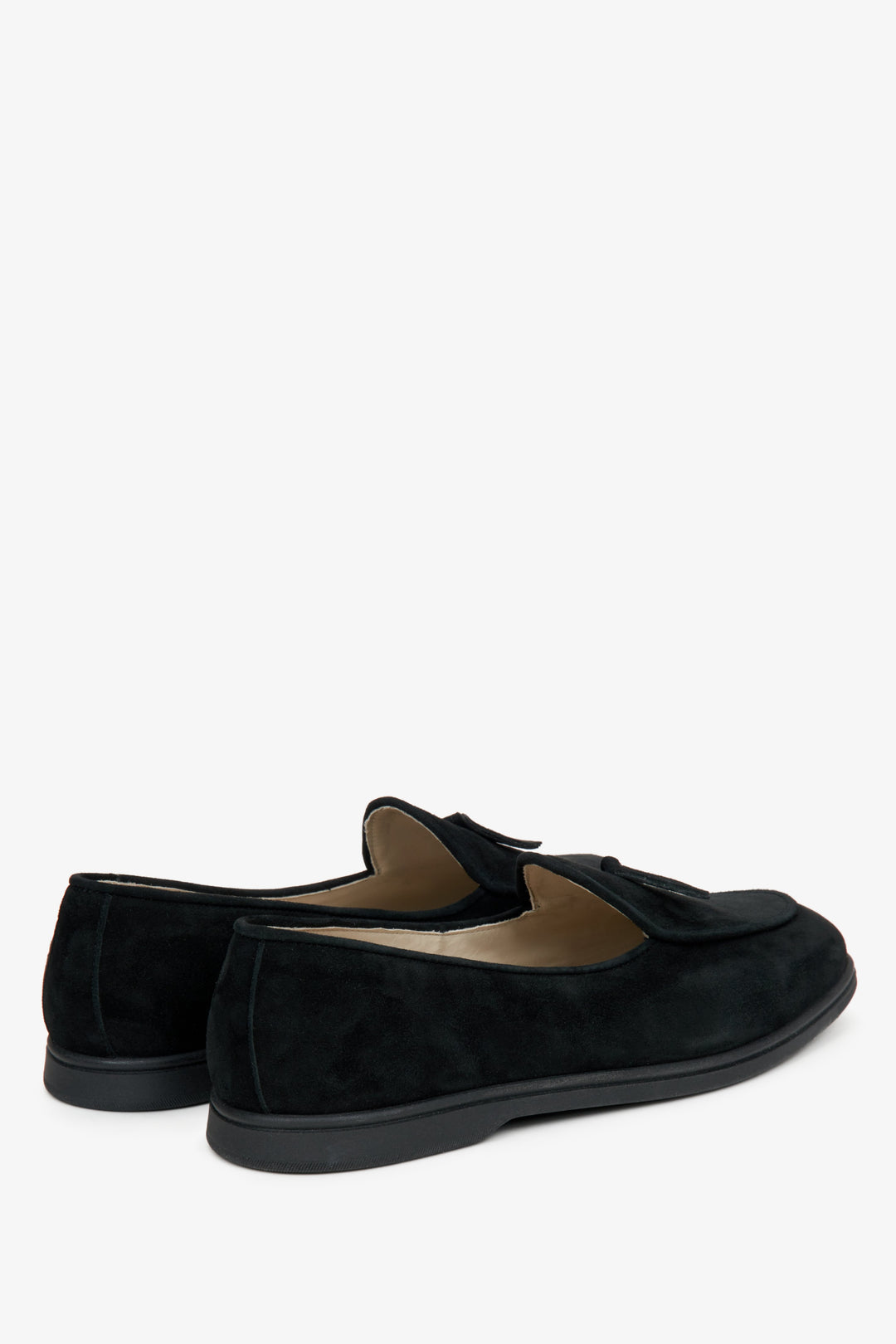 Women's black velour loafers by Estro - close-up on the heel counter and side profile of the shoes.