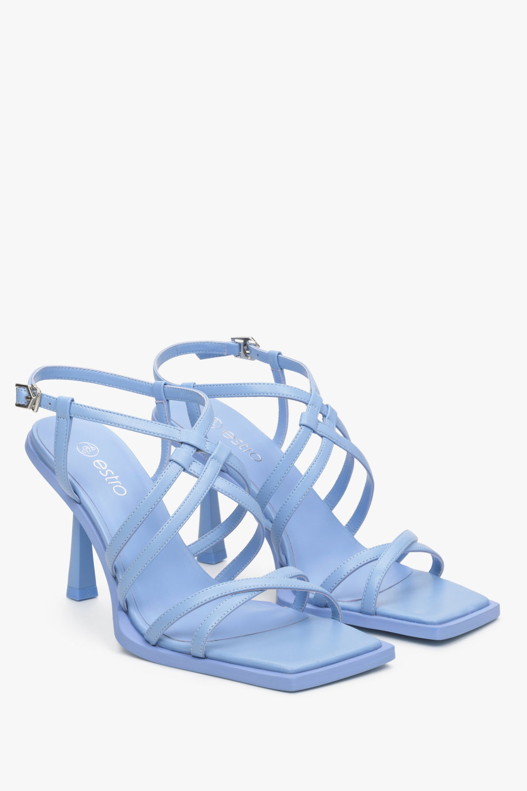 Light blue women's strappy sandals on a funnel heel, Estro brand.