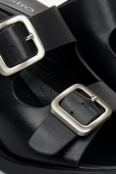 Women's black leather mules by Estro - close-up of the buckle.